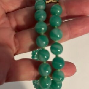 Vintage glass balls individually knotted by hand with gold tone closure by Jonne